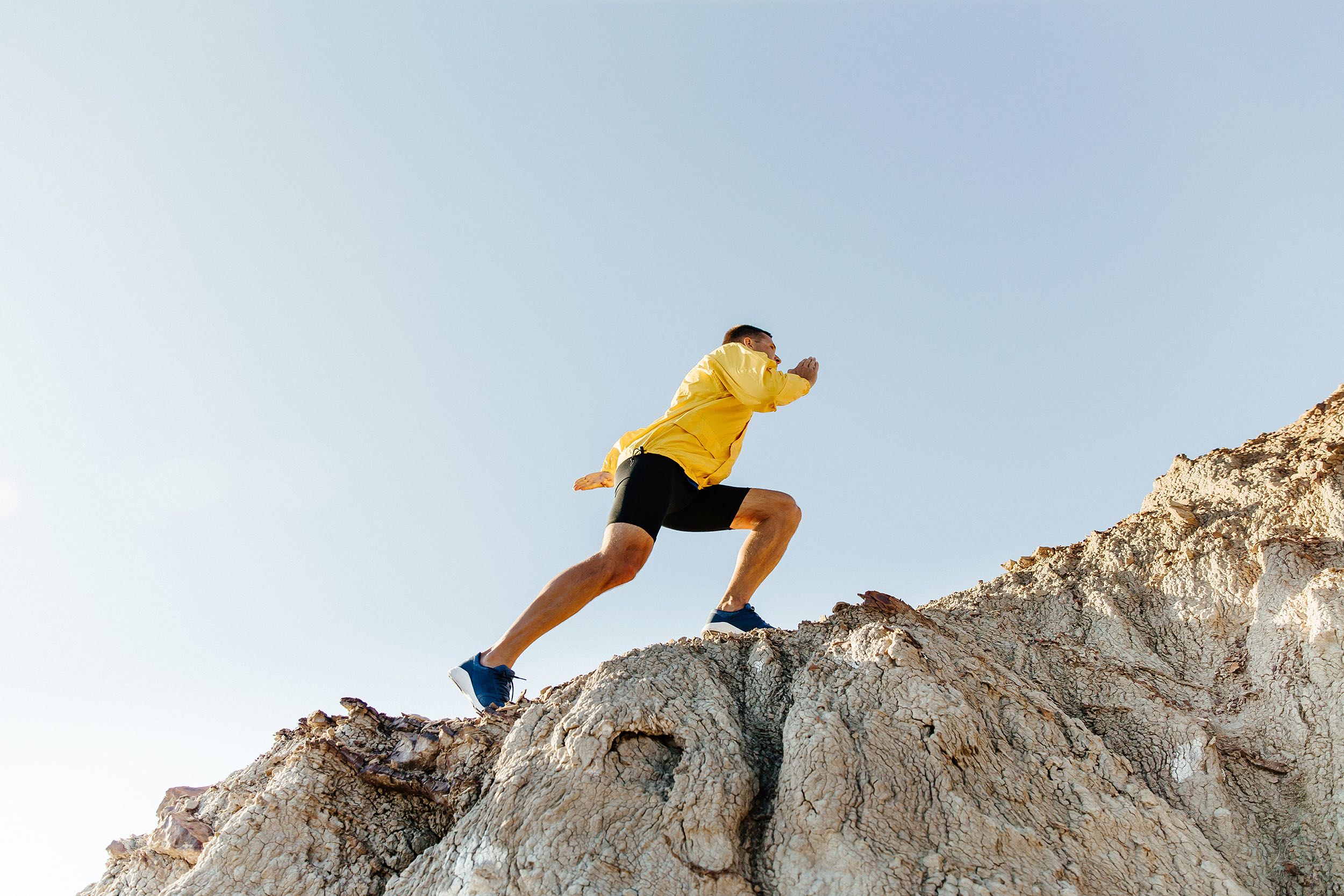 man climbing a mountain | HR Business Consultant