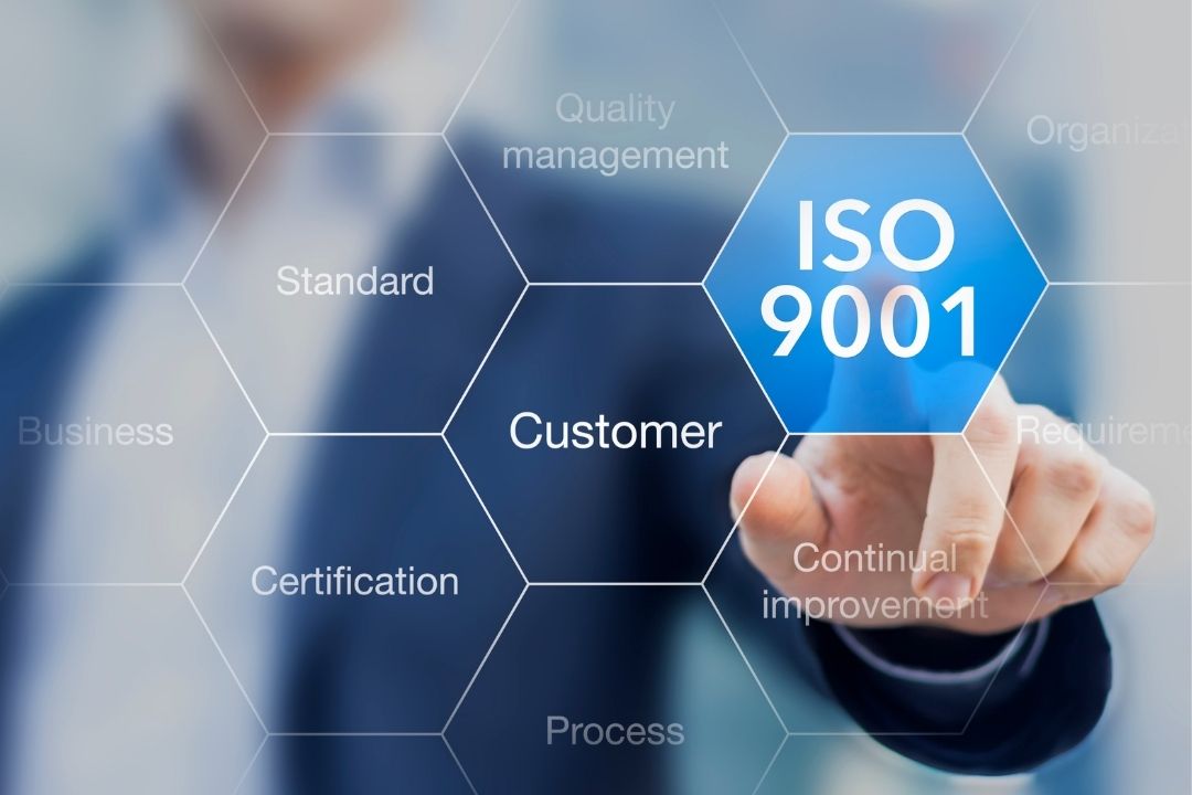 Person pointing to an ISO 9001 bubble | Featured image for what is ISO9001 blog.